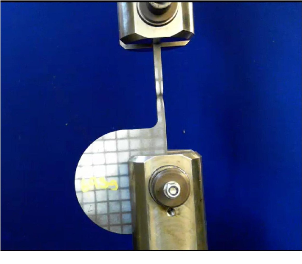 Photograph of the manufactured steel hook specimen at the moment just before complete fracture during the destructive tensile test